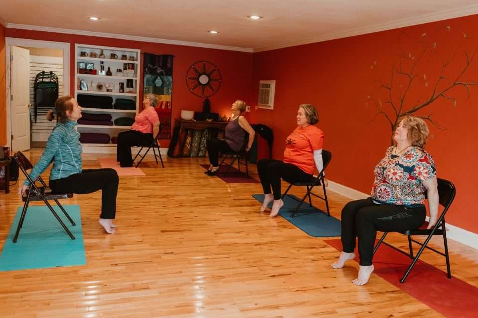 Bonnie’s class seated upward facing dog